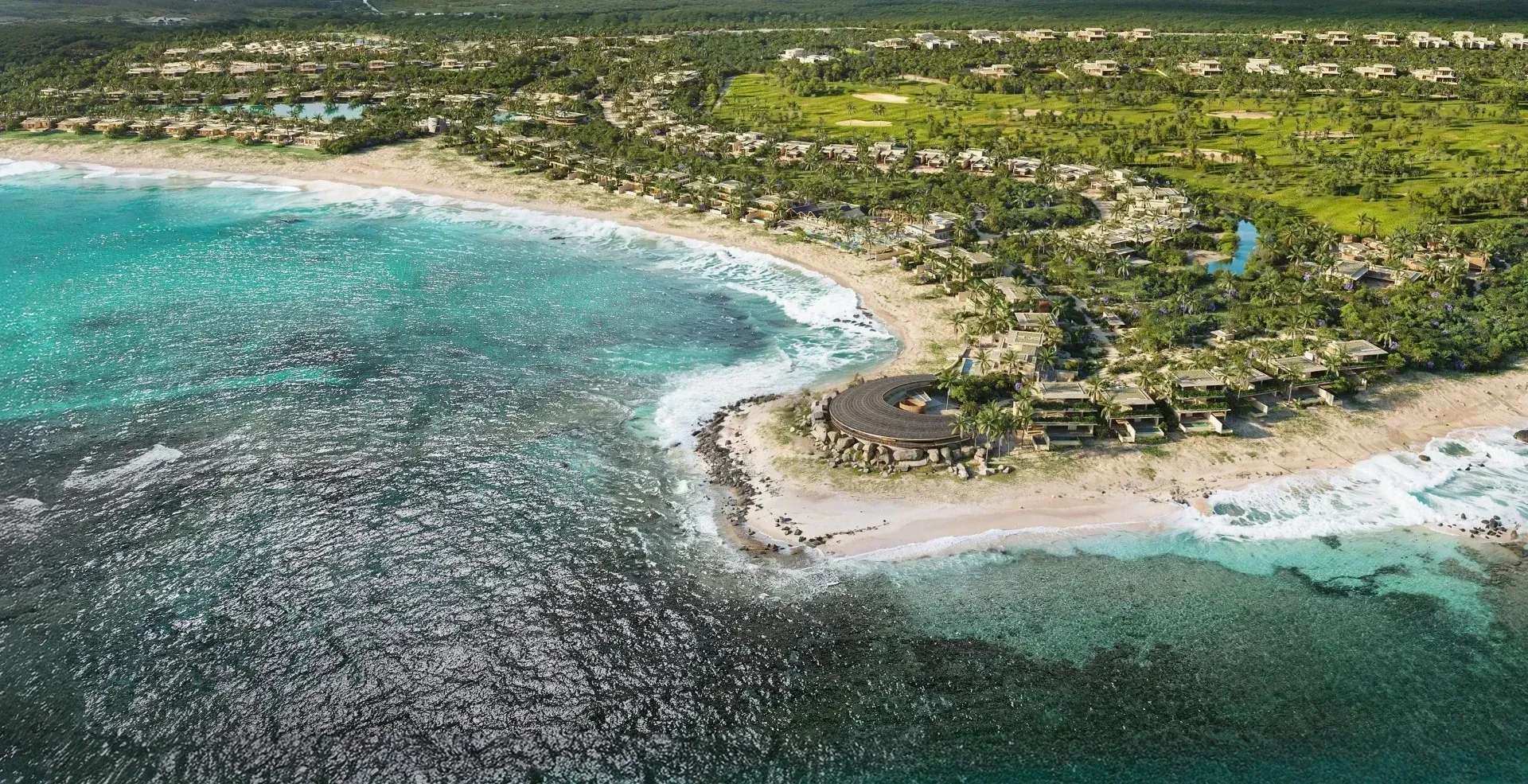 Aerial rendering of Cotton Bay, a Ritz-Carlton Reserve, on the southern coast of Eleuthera, with a round pavilion on the rocky point above the beach and the golf course inland